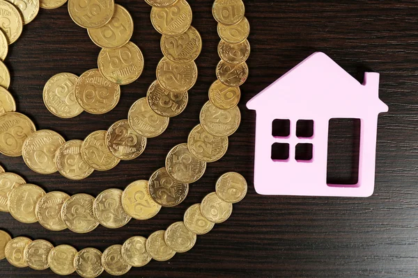 Model of house with coins — Stock Photo, Image