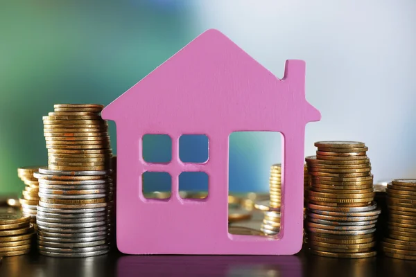 Model of house with coins — Stock Photo, Image