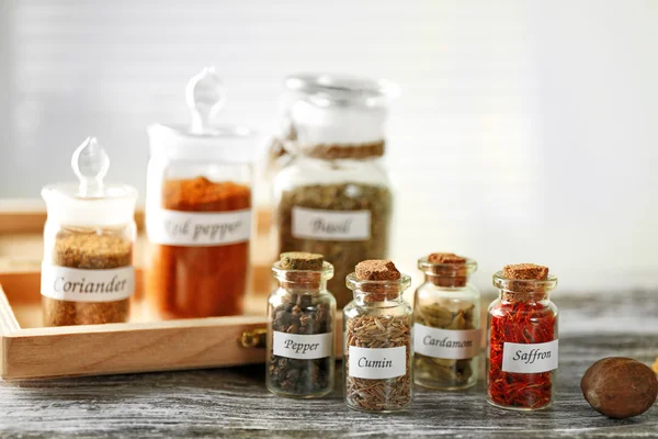 Spices in glass bottles — Stock Photo, Image