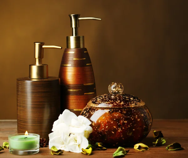 Composition of spa treatment on wooden table, on dark color background — Stock Photo, Image