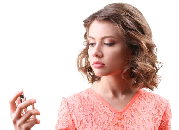 Hermosa mujer con frasco de perfume aislado en blanco — Foto de Stock