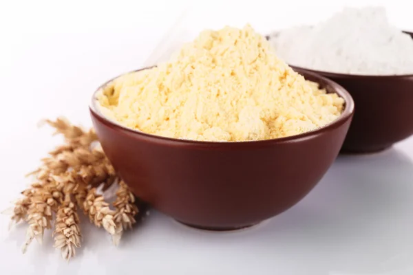 Flour in bowls with wheat ears, closeup — Stock Photo, Image