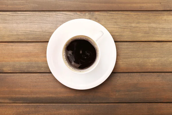 Tasse Kaffee auf Holztisch, Draufsicht — Stockfoto