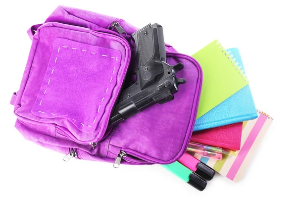 Gun in school backpack — Stock Photo, Image