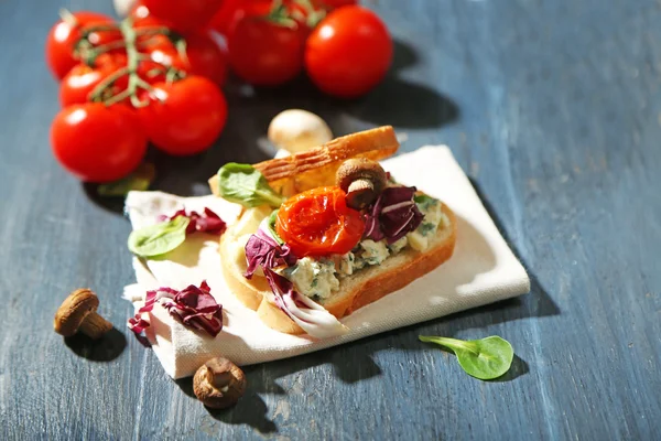 Tasty sandwich on wooden table — Stock Photo, Image