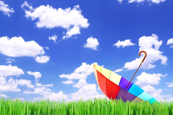 Colorful umbrella on sky background — Stock Photo, Image