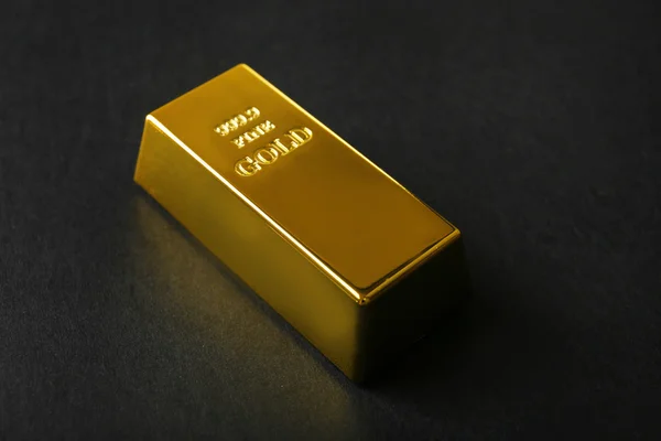 Gold bar on black background — Stock Photo, Image