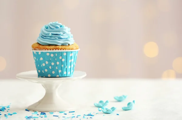 Sweet cupcake on table on light background — Stock Photo, Image