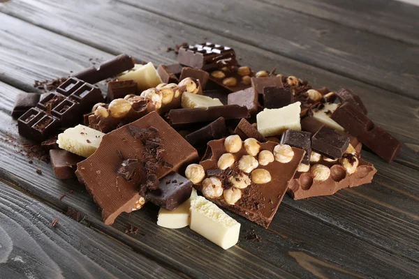 Set of chocolate with hazelnut on wooden background — Stock Photo, Image