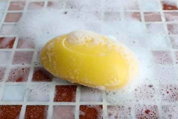 Soap with bubble on mosaic tiles background — Stock Photo, Image