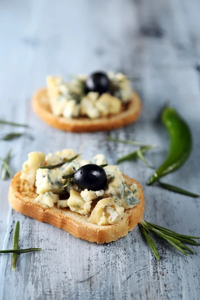 Tasty sandwich on wooden table, close up — Stock Photo, Image