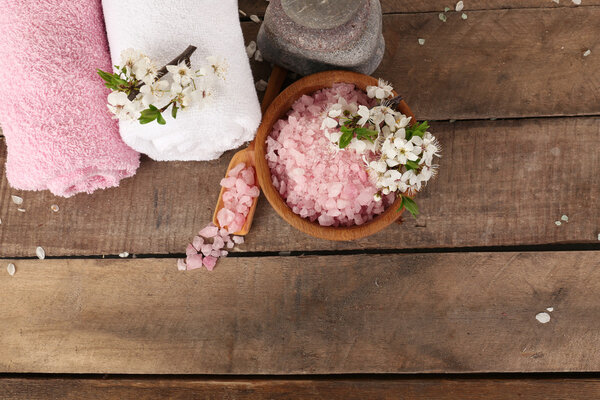 Beautiful spa composition with spring flowers on wooden background