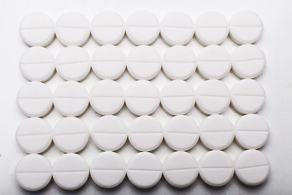 Pile of white pills, closeup — Stock Photo, Image