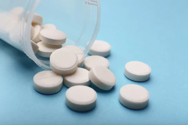 Heap of pills on color background — Stock Photo, Image