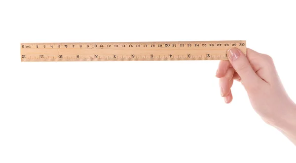 Female hand with wooden ruler — Stock Photo, Image