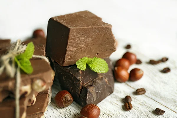 Set of chocolate on wooden table, closeup — Stock Photo, Image