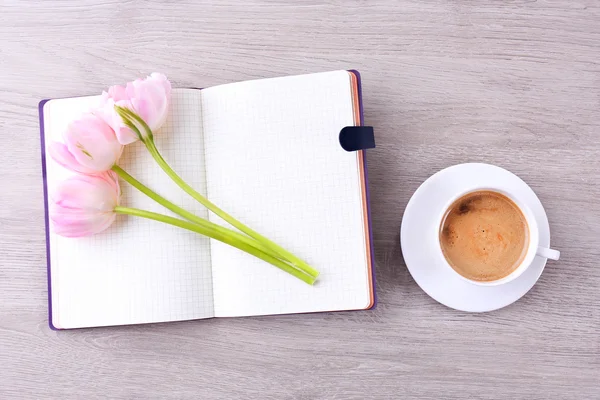 Tulips with diary and cup of coffee — Stock Photo, Image