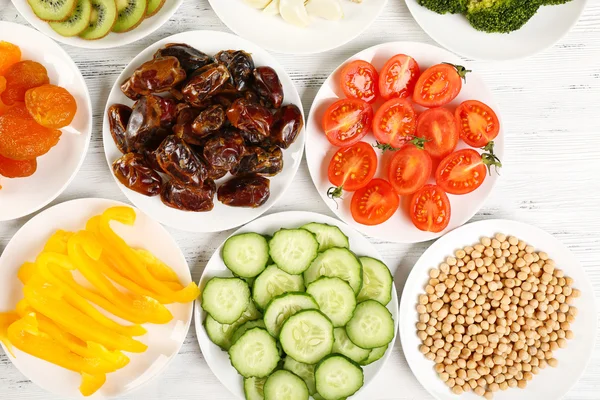 Different products on saucers — Stock Photo, Image