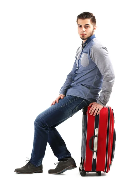 Man in het blauwe shirt en spijkerbroek met koffer geïsoleerd op wit — Stockfoto