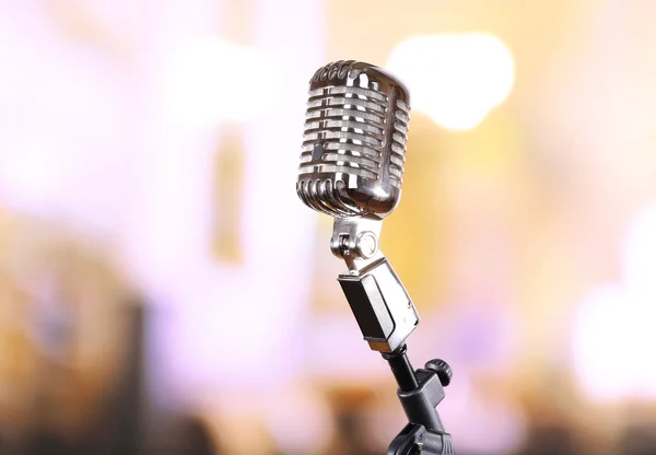 Retro microphone on bright blurred background — Stock Photo, Image