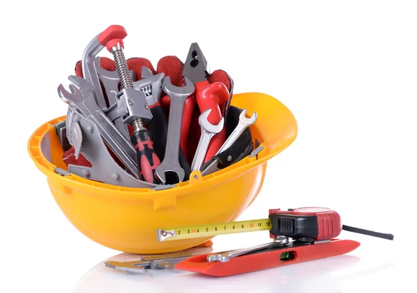 Construction tools in helmet — Stock Photo, Image