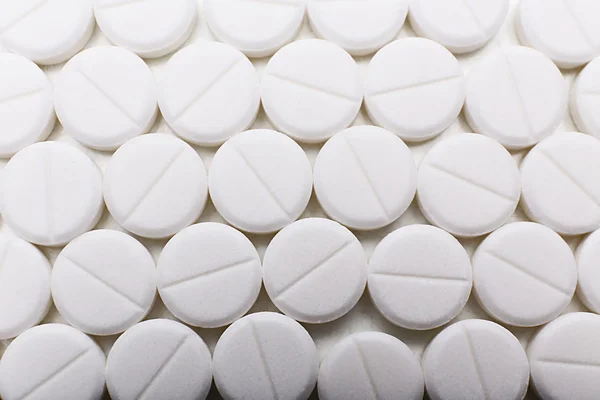 Montón de pastillas blancas, primer plano — Foto de Stock