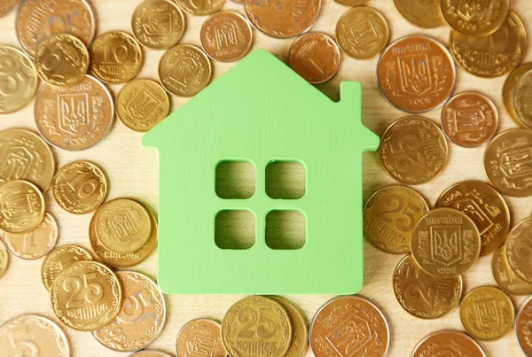 Model of house with coins — Stock Photo, Image