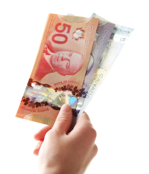 Vrouwelijke hand met Canadese dollars, geïsoleerd op wit — Stockfoto