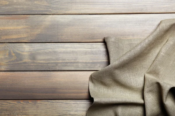 Napkin on wooden table — Stock Photo, Image