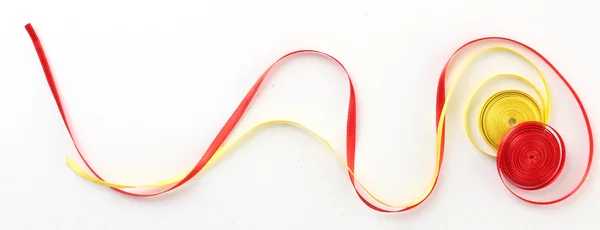 Colorful red and yellow ribbons isolated on white — Stock Photo, Image