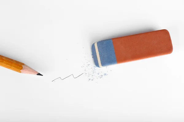 Eraser and pencil on paper background — Stock Photo, Image