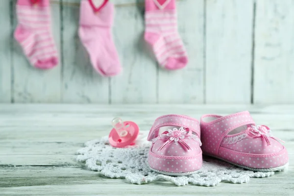 Cute toddler shoes on wooden background — Φωτογραφία Αρχείου