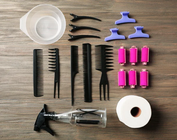 Hairdressing tools on wooden background — Stock Photo, Image