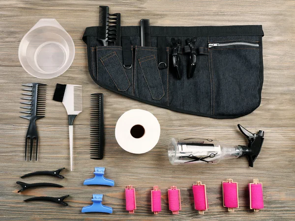 Hairdressing tools on wooden background — Stock Photo, Image