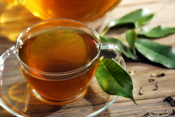 Cup of green tea on table close-up