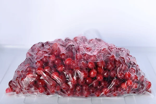 Frozen berries in bag in freezer close up — Stock Photo, Image