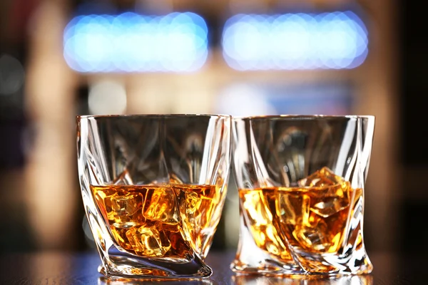 Glasses of whiskey on bar background — Stock Photo, Image