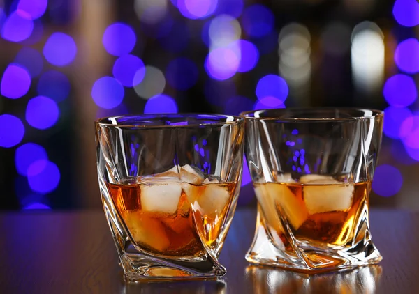 Glasses of whiskey on bar background — Stock Photo, Image