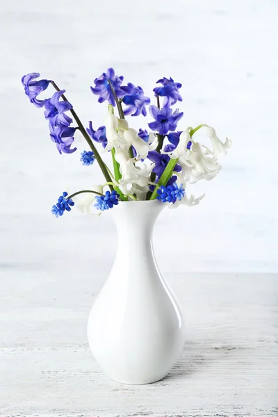 Fresh hyacinth flowers on white wooden background — Stock Photo, Image