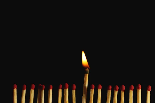 Burning matches on dark background — Stock Photo, Image