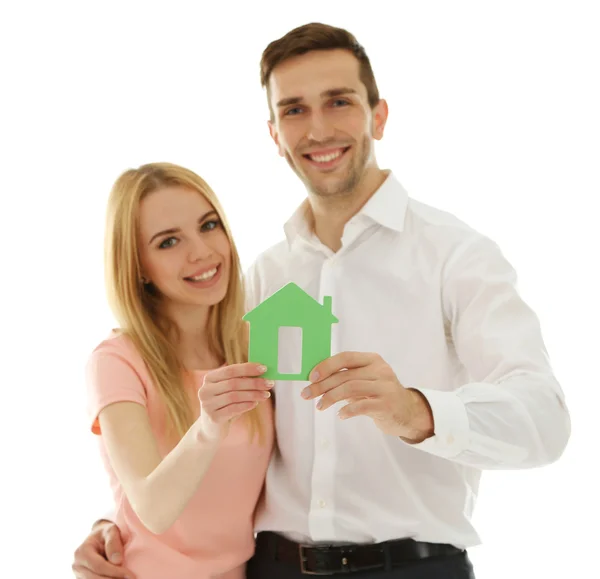Attractive young couple with decorative house, isolated on white — Stock Photo, Image