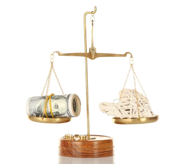 Geld en hart in evenwicht schalen — Stockfoto