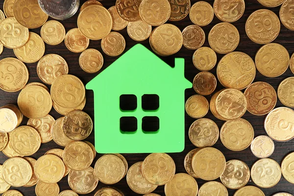 Model of house with pile of coins, closeup — Stock Photo, Image