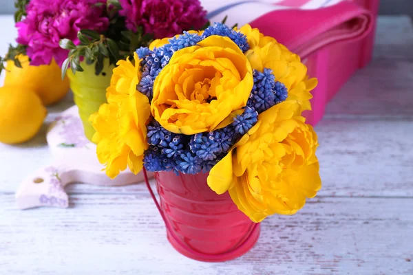 Composition with fresh spring flowers on wooden table, closeup — Stock Photo, Image
