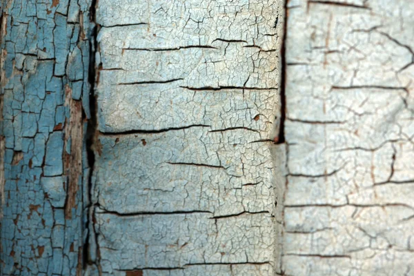 Pelar pintura sobre fondo texturizado de madera — Foto de Stock