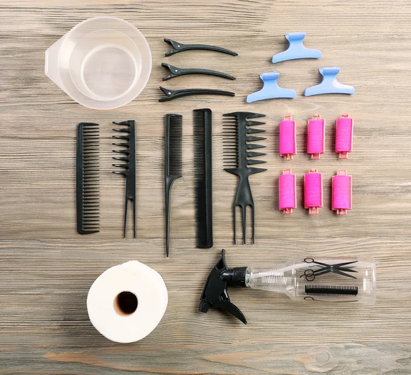 Hairdressing tools on wooden background — Stock Photo, Image