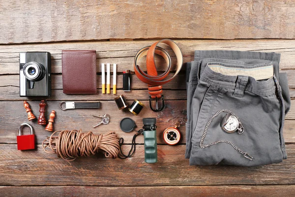 Hiking gear on wooden background — Stock Photo, Image