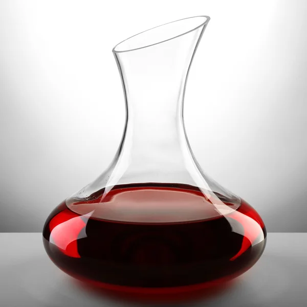 Glass carafe of wine on light background — Stock Photo, Image