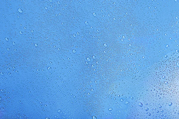 Gotas de água no fundo azul claro — Fotografia de Stock