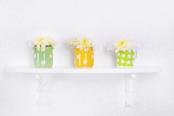 Flower on shelf on white wall background — Stock Photo, Image